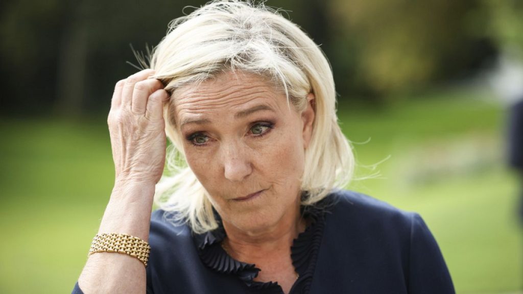 French far-right leader Marine Le Pen gestures at the Elysee Palace Monday, Aug. 26, 2024 in Paris.