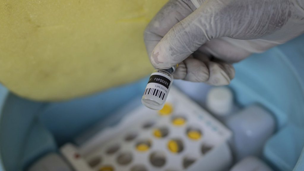 A nurse holds a bottle of mpox vaccine in the Democratic Republic of Congo in October 2024.