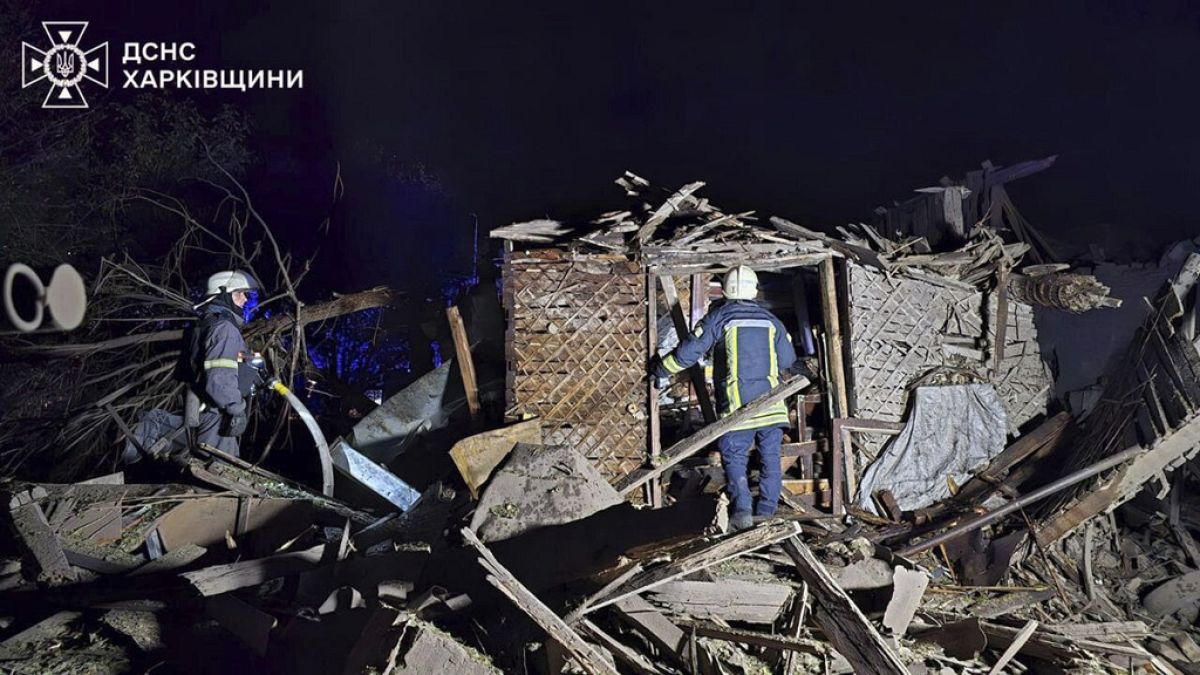 In this photo provided by the Ukrainian Emergency Service on Oct. 21, 2024, rescue workers clear the rubble of a house destroyed by a Russian strike in Kharkiv, Ukraine.