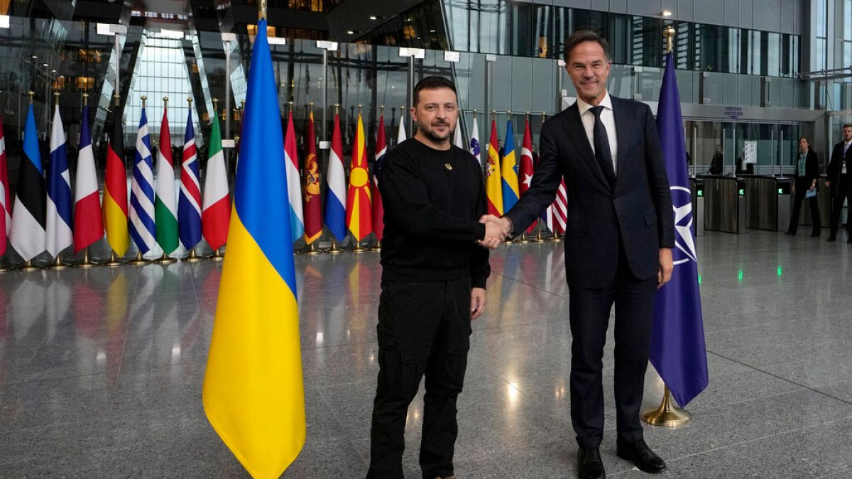 NATO Secretary General Mark Rutte, right, shakes hands with Ukraine