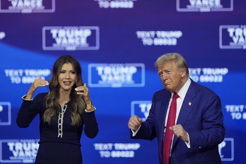 Donald Trump and South Dakota Gov. Kristi Noem dance to the song 