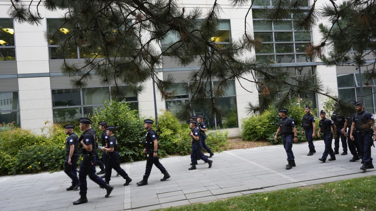 File photo: French police walk through a street in Paris in July 2024