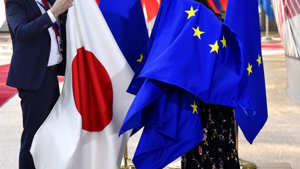 File photo: European Union and Japanese flags at the European Council building in Brussels