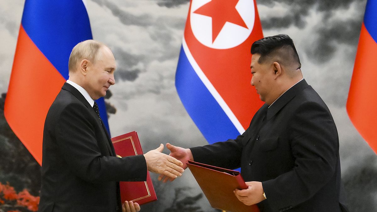 Russian President Vladimir Putin, right, and North Korea