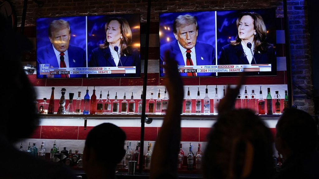 Viewers watch a debate between Kamala Harris and Donald Trump at a bar in San Antonio, 10 September, 2024