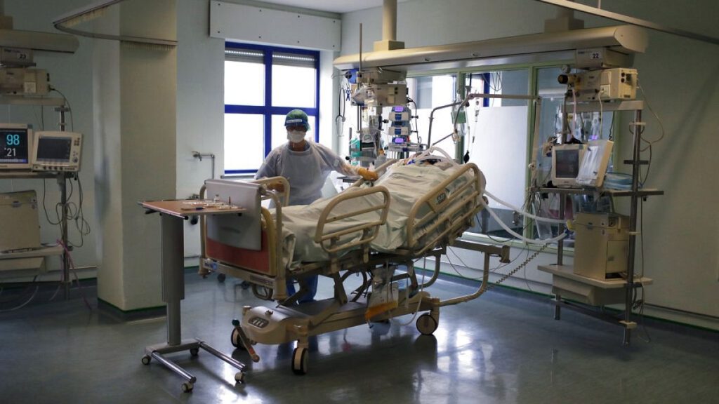 Archive: A nurse cares for a patient in the COVID-19 Intensive Care Unit at Curry Cabral hospital in Lisbon, Thursday, Feb. 11, 2021.