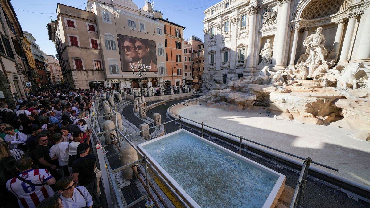 A small pool is seen in front of the Trevi Fountain to allow tourists to throw their coins in it, as the fountain has been emptied to undergo maintenance, 1 November 2024.