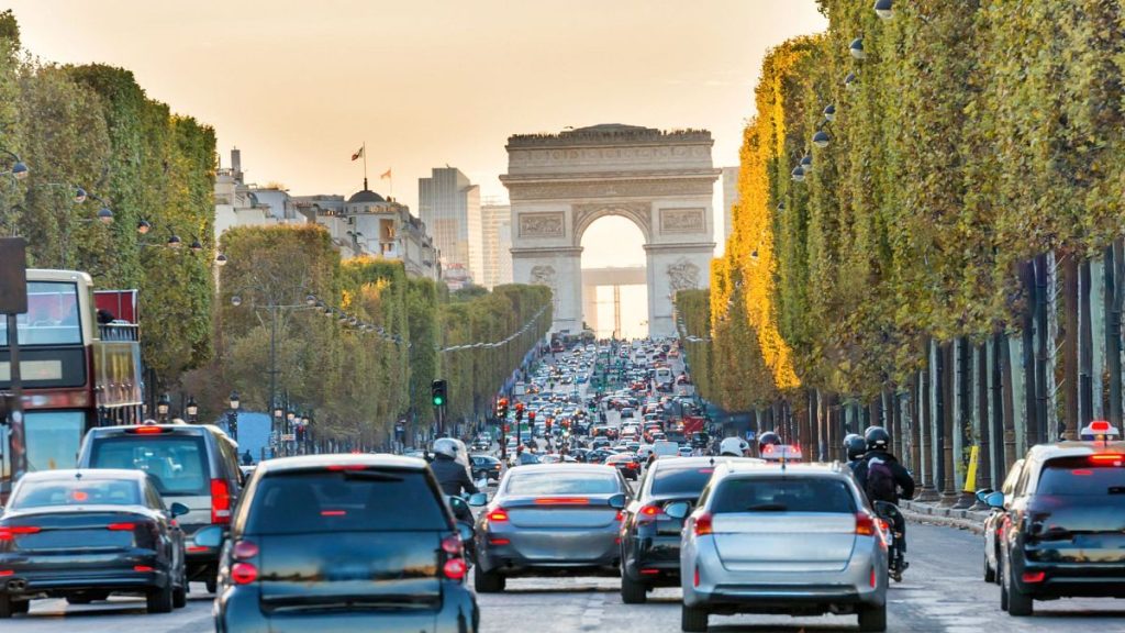 Traffic along Avenue des Champs-Elysees with Arc de Triomph view