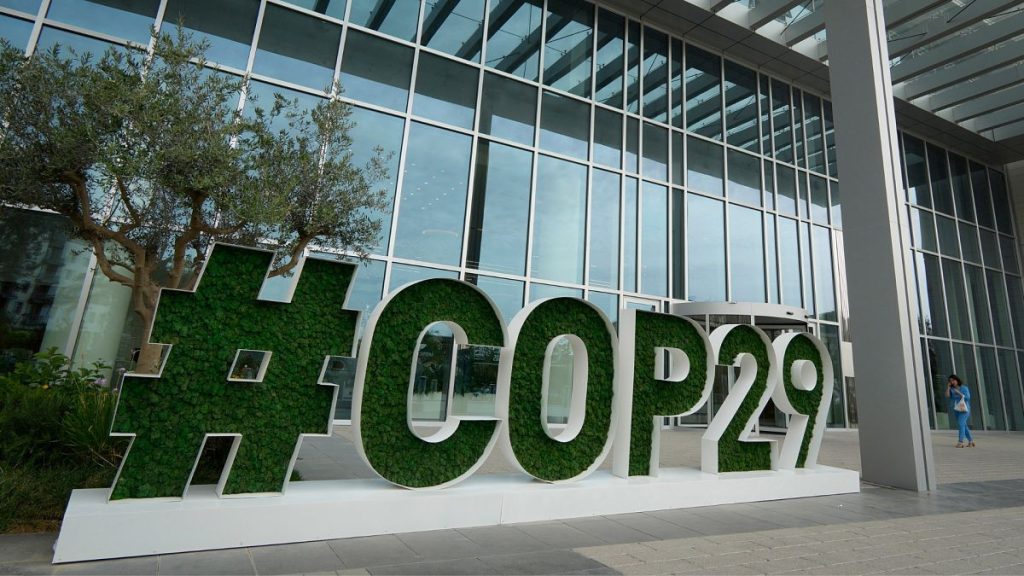 A sign for COP29, the United Nations Climate Change Conference, sits outside the headquarters in Baku, Azerbaijan.