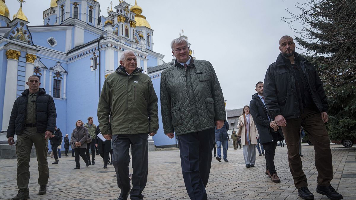 European Union foreign policy chief Josep Borrell and Ukrainian Minister of Foreign Affairs Andrii Sybiha walk in front of St. Michael