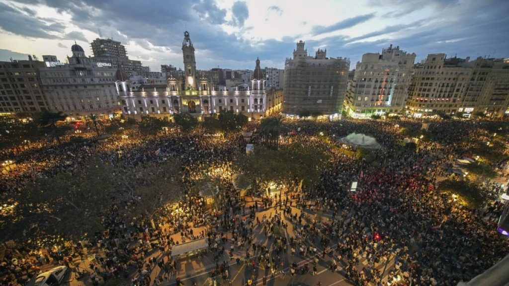 Thousands of demonstrators gather in front of the Valencia city council for a protest denouncing the handling of recent flooding.