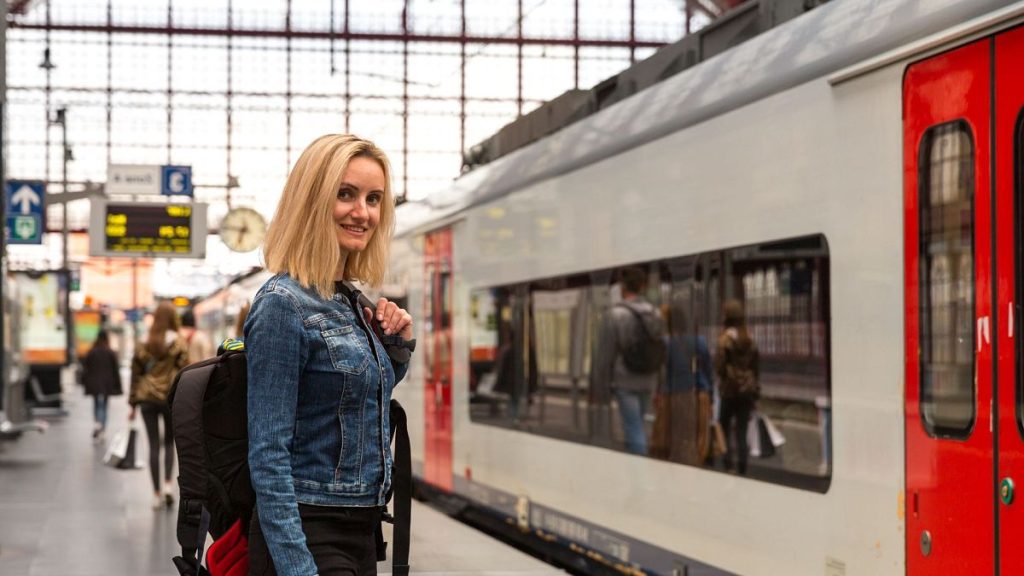 Lady stands on a European train platform