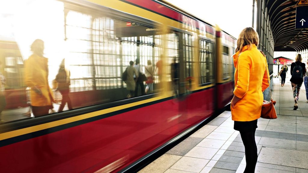 A European woman waits for a train