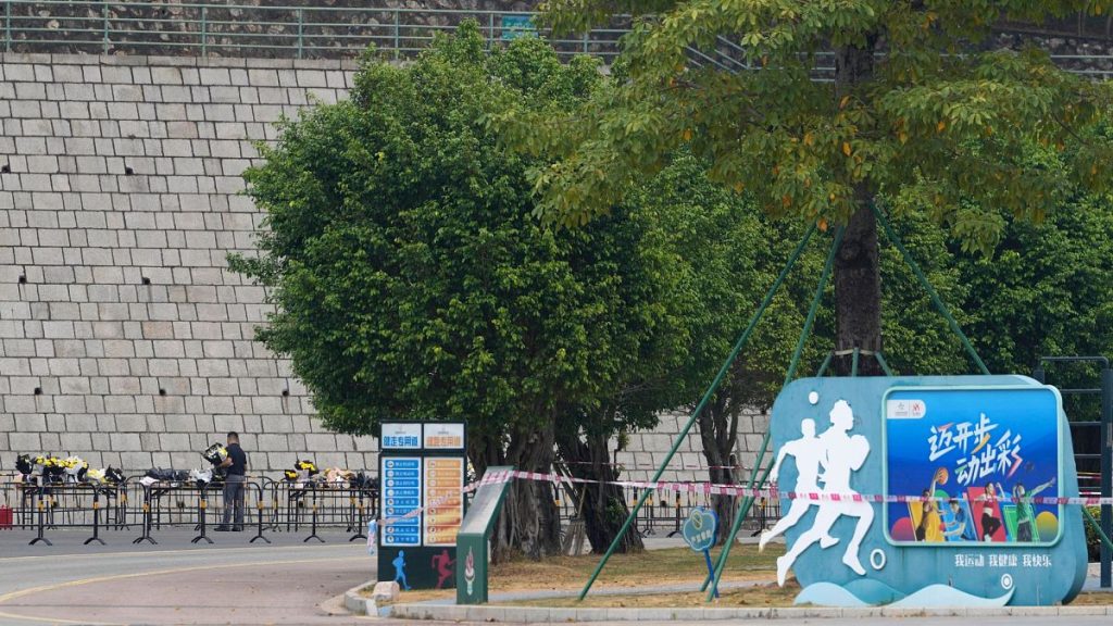 Volunteers relocate flowers laid outside "Zhuhai People