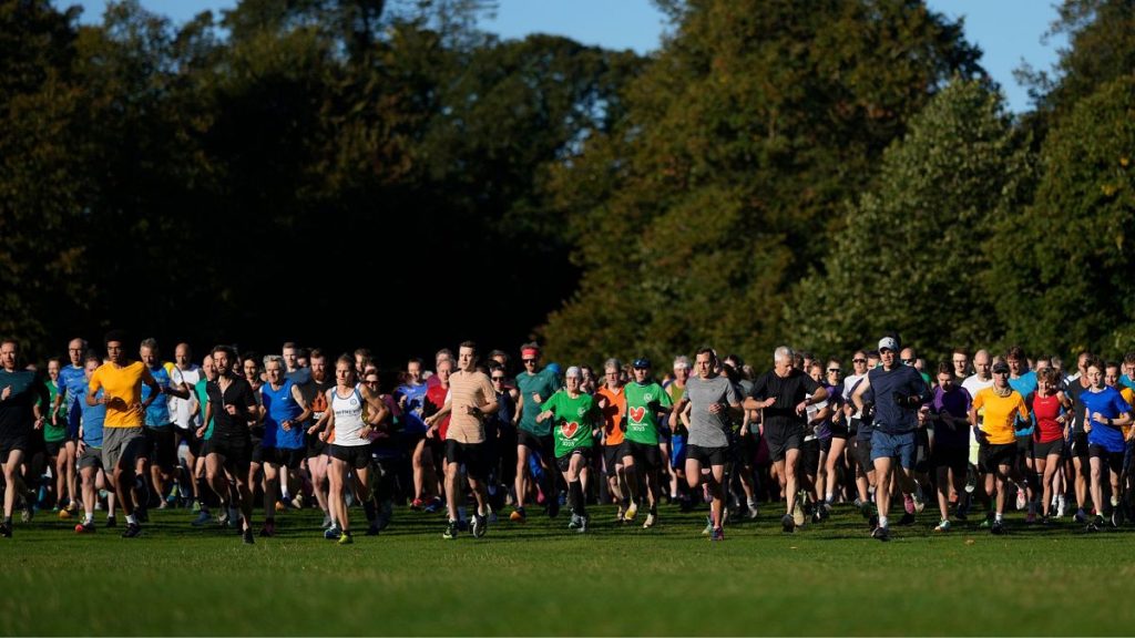 Runners compete in the parkrun event in Bushy Park, southwest London, Saturday, 28 September 2024.