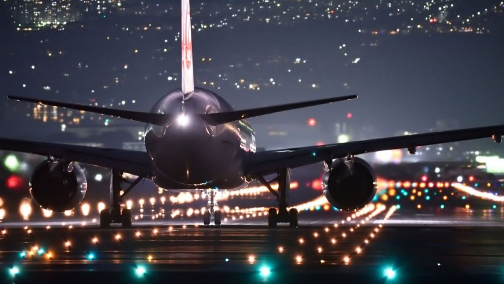 An airplane in airport at night