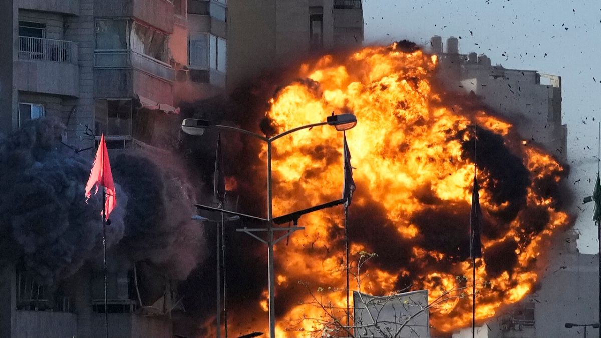 Smoke and flames erupt from a building hit in an Israeli airstrike in Tayouneh, Beirut, Lebanon, Friday, Nov. 15, 2024.