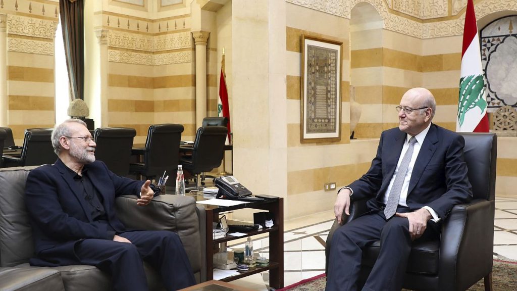 Lebanese caretaker Prime Minister Najib Mikati, right, meets with Ali Larijani, an adviser to Iran