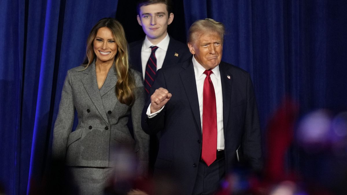 Republican presidential nominee former President Donald Trump, joined by Melania Trump, left, and Barron Trump, arrives at an election night watch party, November 6th 2024