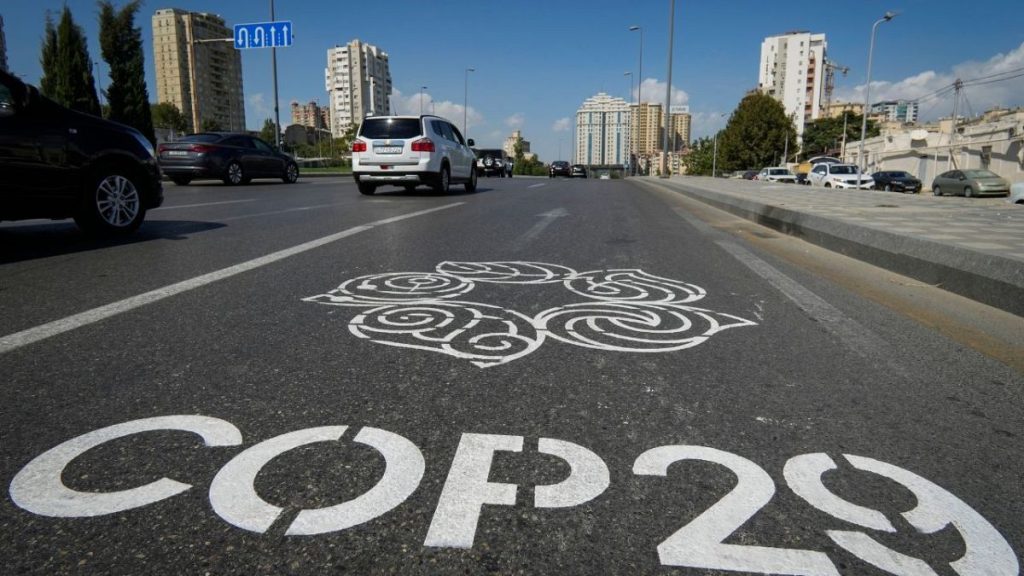 The logo for the COP29 United Nations Climate Change Conference is painted on a road in Baku, Azerbaijan, Monday, Sept. 16, 2024.