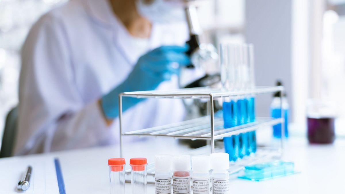 Medical research scientist working with a microscope to do research