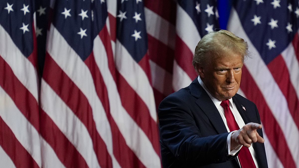 Republican presidential nominee former President Donald Trump points to the crowd at an election night watch party on November 6, 2024, in West Palm Beach, Florida.