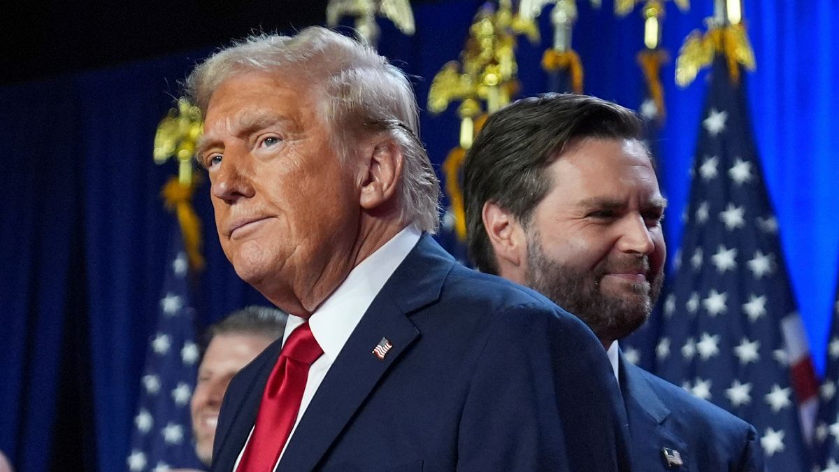 Donald Trump and his running mate Sen. JD Vance, R-Ohio, stand on stage at an election night watch party