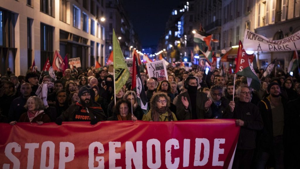 Protesters take part in a rally against the