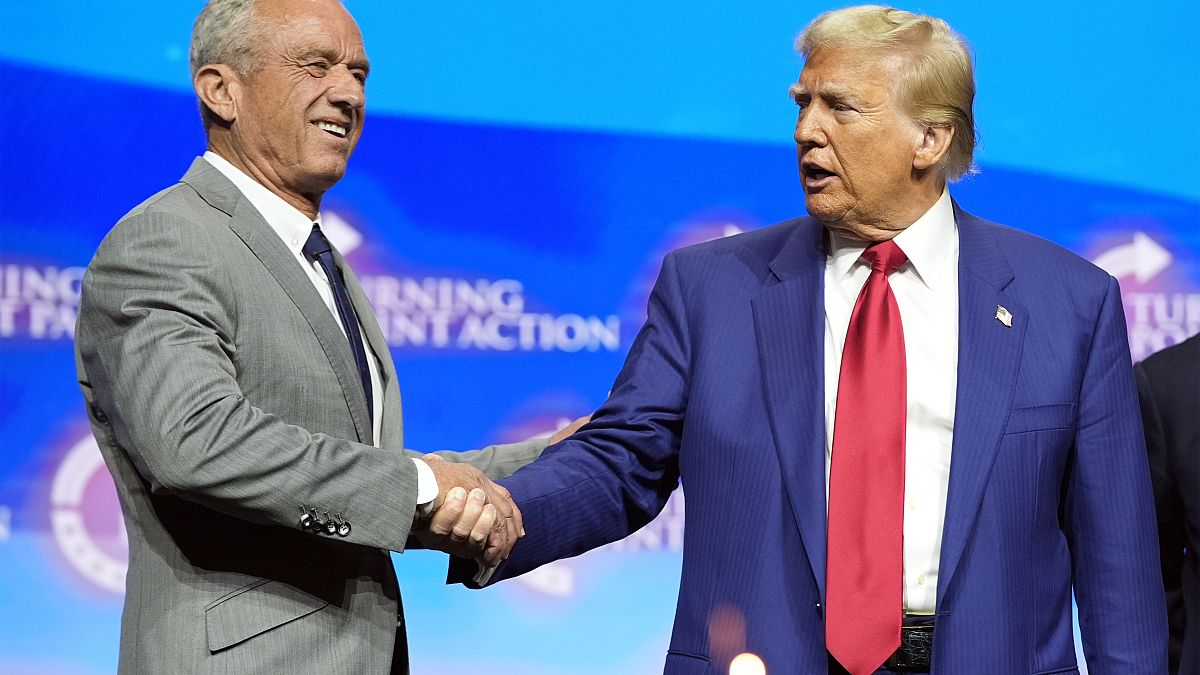 Donald Trump shakes hands with Robert F. Kennedy Jr. at a campaign rally in Georgia in October 2024.