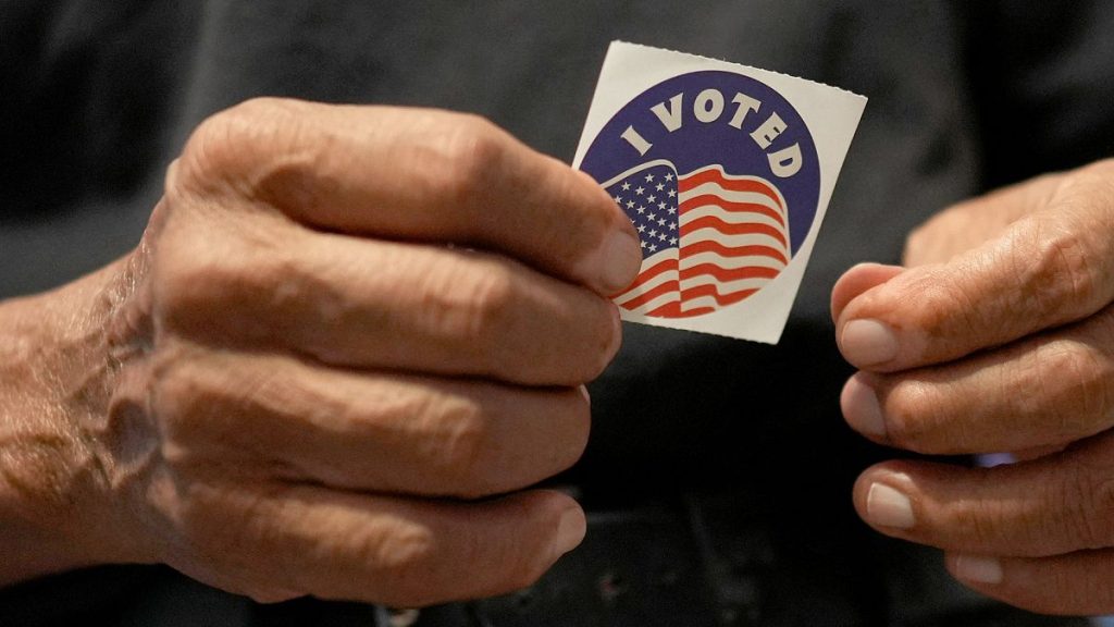 Carlos Salas, 78, who recently became a US citizen and voted in his first election, holds an