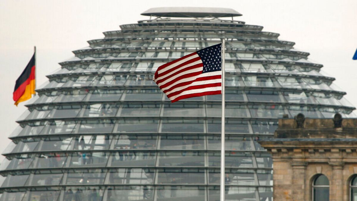 The US flag flies on top of the US embassy in front of the Reichstag building that houses the German Parliament, Bundestag, in Berlin, Germany, Friday, Oct. 25, 2013.