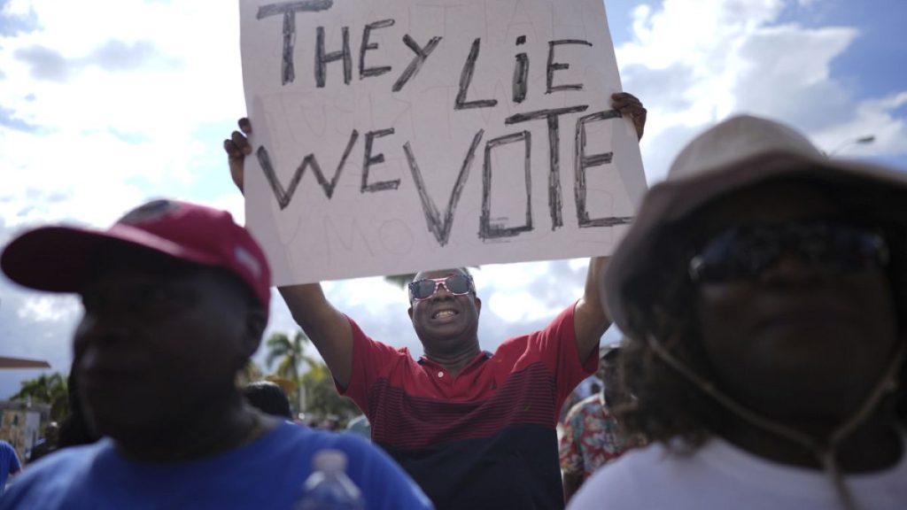 FILE - Harry J. Louis of Miami at a rally of South Florida