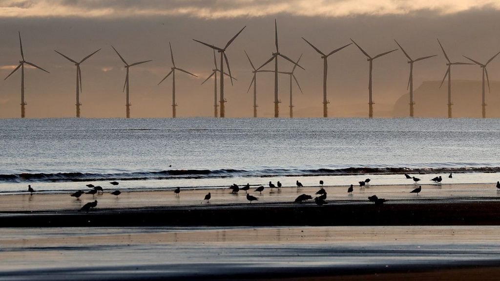 An offshore wind farm is visible from the beach in Hartlepool, England, Nov. 12, 2019.