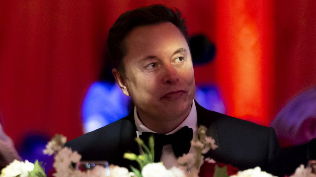 Elon Musk watches before President-elect Donald Trump speaks during an America First Policy Institute gala at his Mar-a-Lago estate, Thursday, Nov. 14, 2024, in Palm Beach, Fl