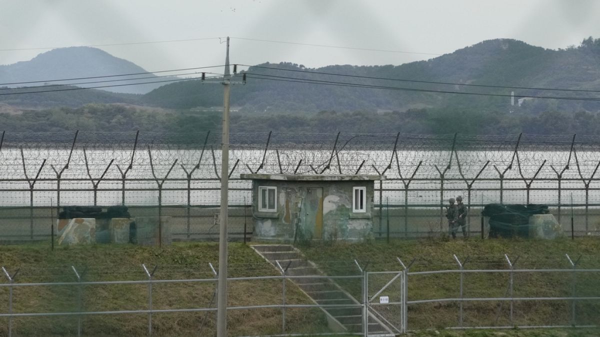 FILE - South Korean army soldiers patrol along the barbed-wire fence in Paju, South Korea, near the border with North Korea, Monday, Oct. 14, 2024. (AP Photo/Ahn Young-joon)