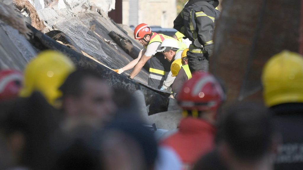 Rescue workers search for victims in the aftermath of an outdoor roof collapsed at a train station in Novi Sad, 1 November 2024