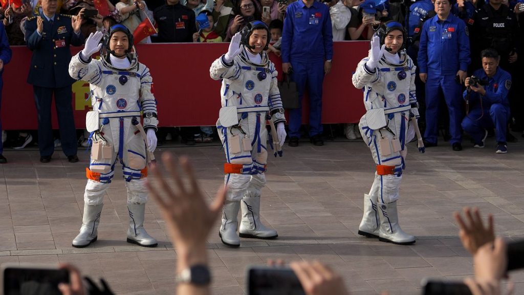 File- Chinese astronauts for the Shenzhou-18 mission, from right, Ye Guangfu, Li Cong, and Li Guangsu wave as they attend a send-off ceremony for their manned space mission.