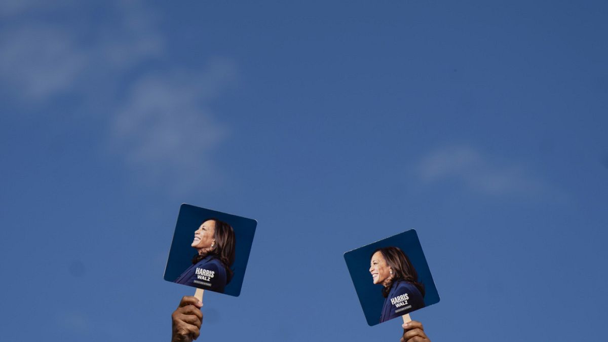 Supporters hold signs before Democratic presidential nominee Vice President Kamala Harris arrives to speak at a campaign rally, Wednesday, Oct. 30, 2024, in Raleigh, N.C.