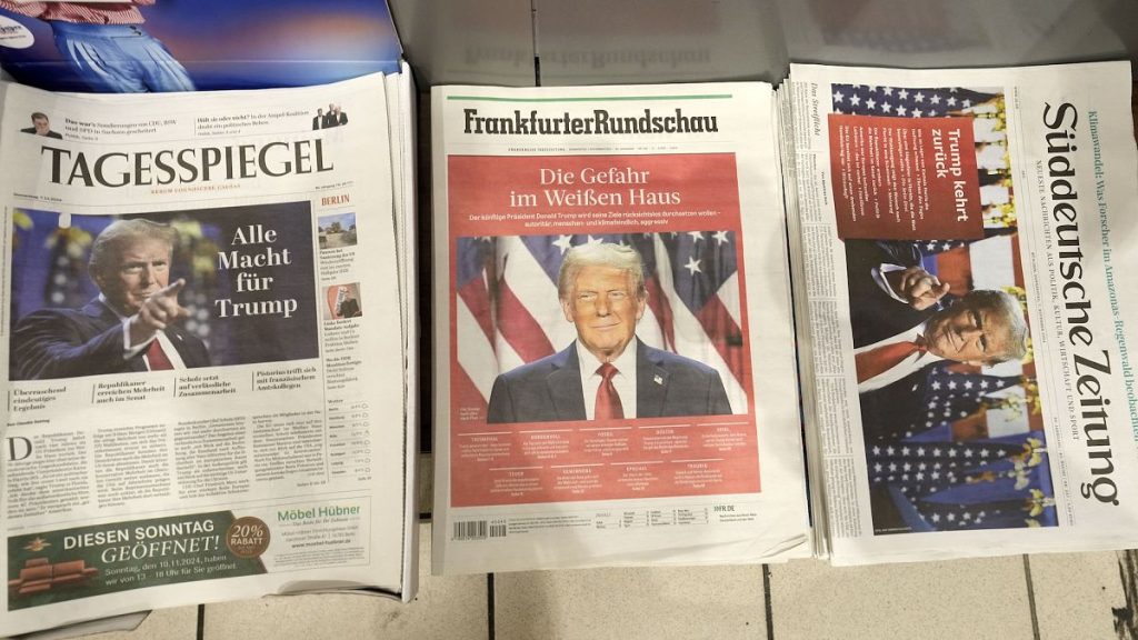 German newspapers front-pages with President-elect Donald Trump are seen at a station kiosk in Cologne, Germany