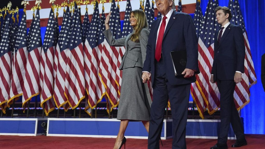 President Donald Trump, his wife Melania and son, Barron as they head towards the White House