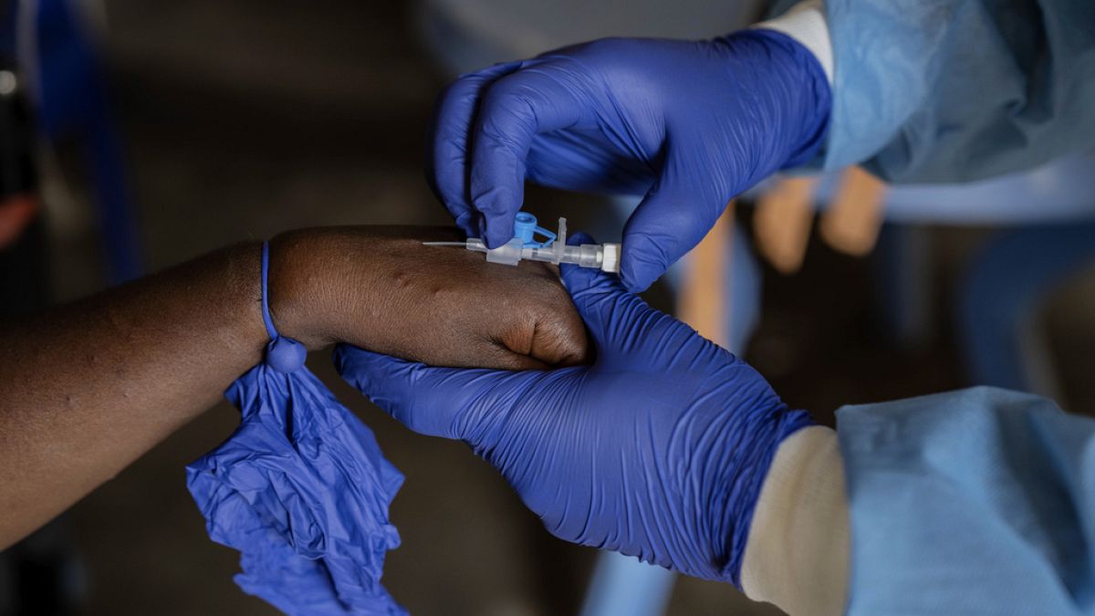 A health worker attends to a mpox patient, at a treatment centre in Munigi, eastern Congo, Aug. 16, 2024