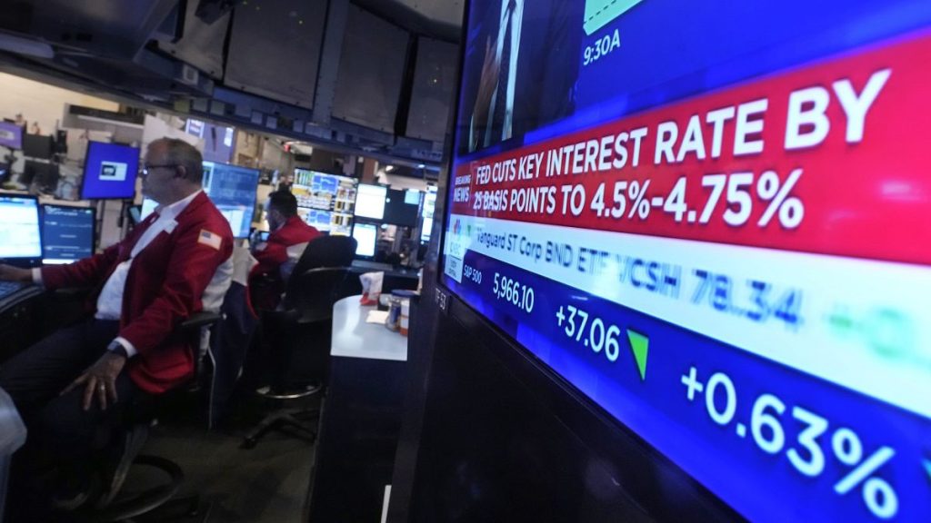 A screen at a trading post on the floor of the New York Stock Exchange displays the Federal Reserve interest rate decision