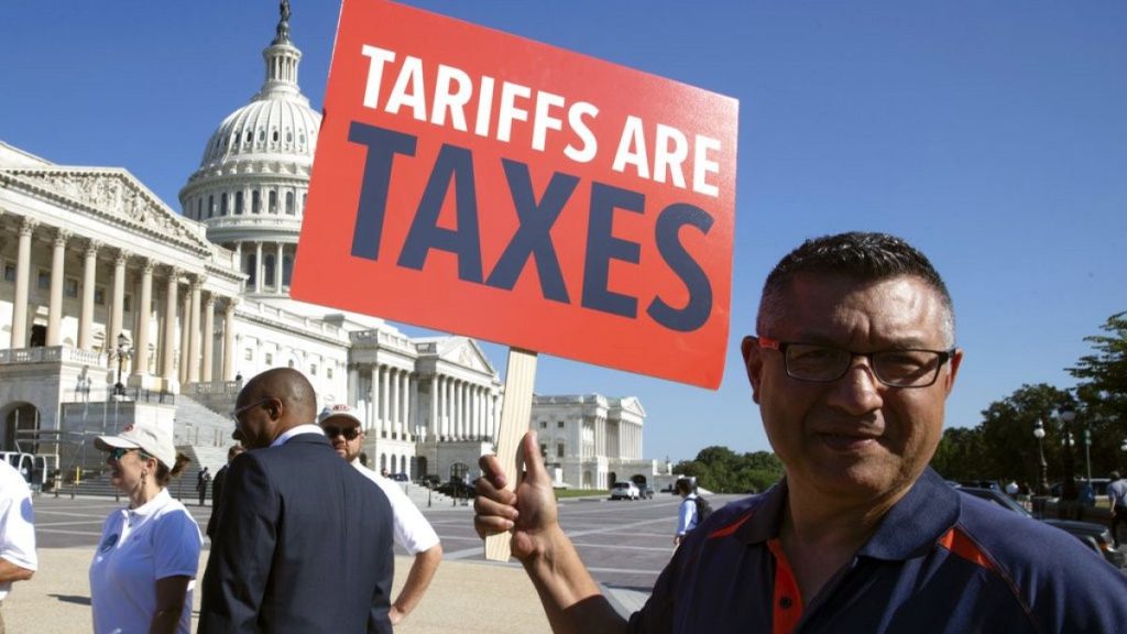 File photo. Employees of international car companies protest against tariffs they say will negatively impact US auto manufacturing. Capitol Hill, Washington. 19 July 2018.