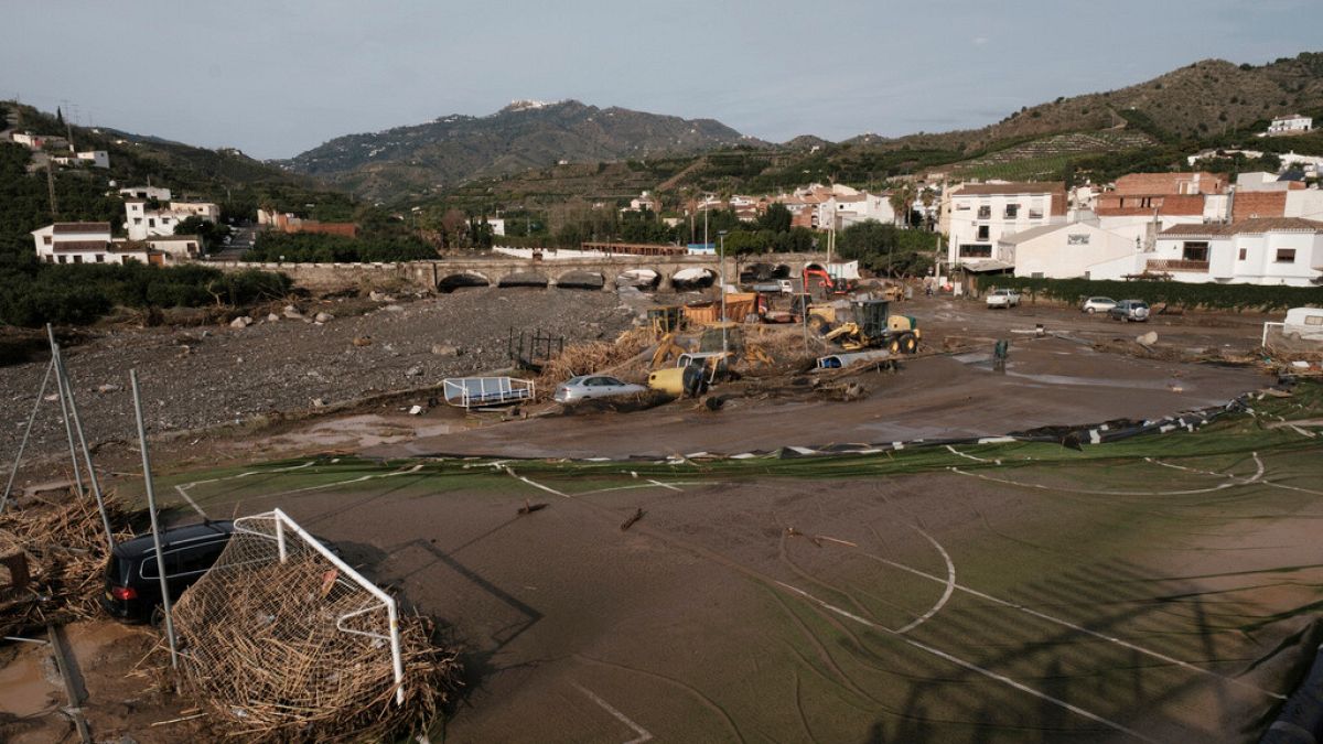 Vehicles are swept away by the floodwaters after the floods in Benagarmosa, Malaga, Spain, Thursday, Nov. 14, 2024.