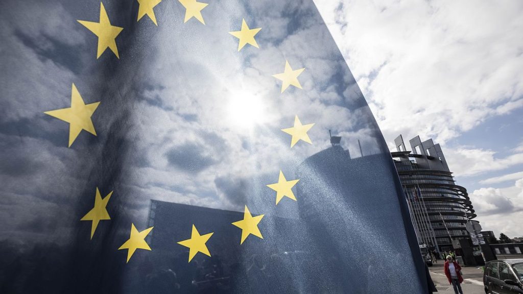 An EU flag flies at the front of the European Parliament building in Strasbourg, France, Tuesday March 26, 2019.