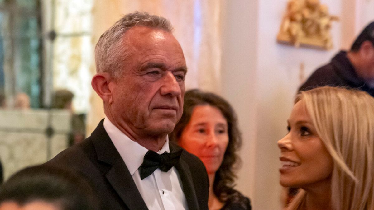 Robert F. Kennedy Jr., and his wife Cheryl Hines arrive before President-elect Donald Trump speaks during an America First Policy Institute gala at his Mar-a-Lago estate.