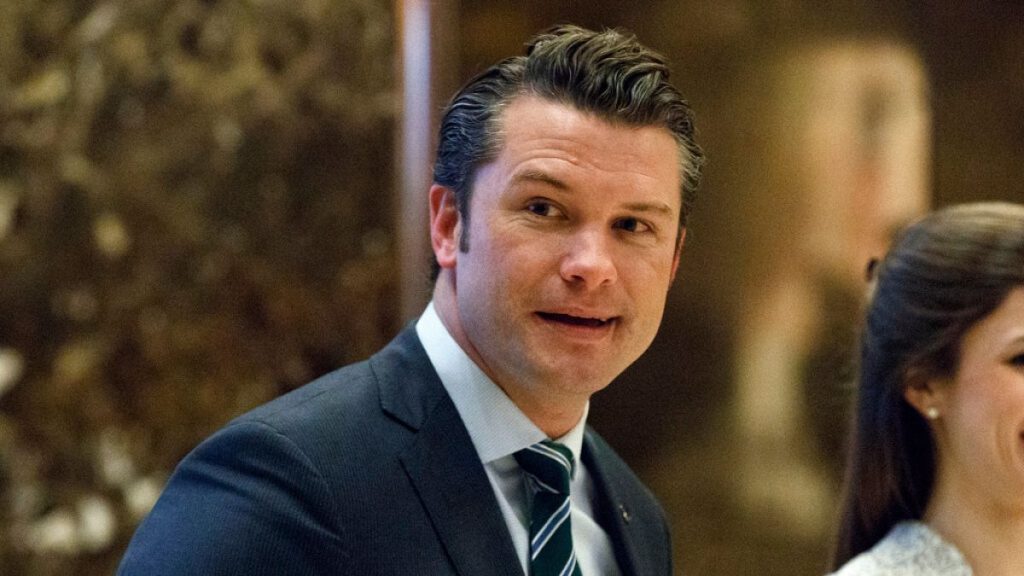 FILE - Pete Hegseth walks to an elevator for a meeting with President-elect Donald Trump at Trump Tower in New York, Dec. 15, 2016.