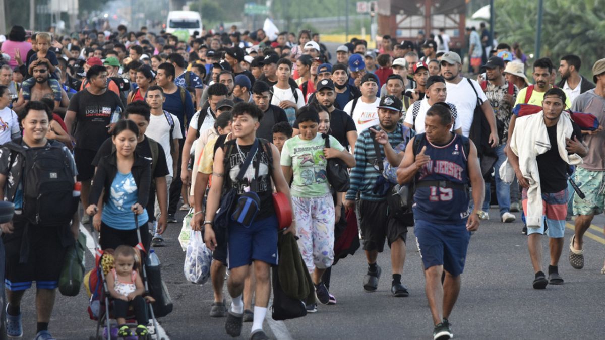 Migrants walk along the highway through Suchiate, Chiapas state in southern Mexico, July 21, 2024, during their journey north toward the U.S. border