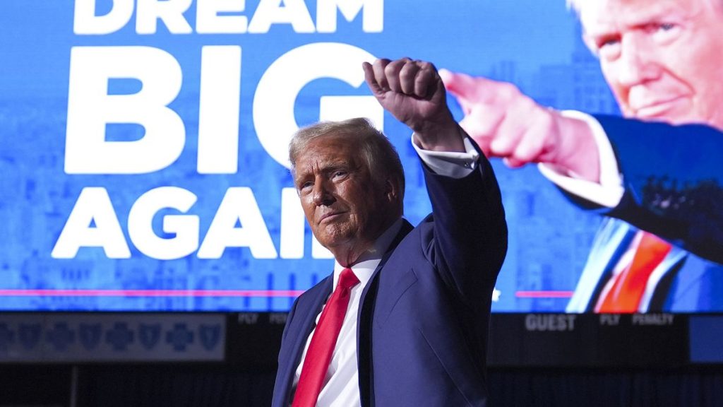 former President Donald Trump gestures at a campaign rally on Tuesday, 5 November in Grand Rapids, Michigan