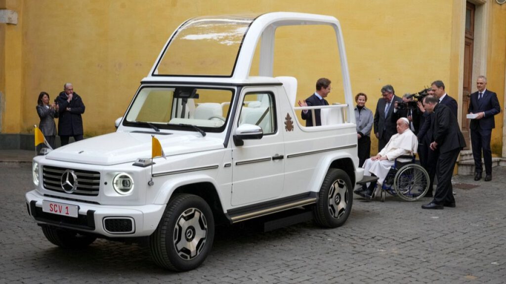 Pope Francis is presented a new fully electric popemobile, at the Vatican, Wednesday, Dec. 4, 2024.